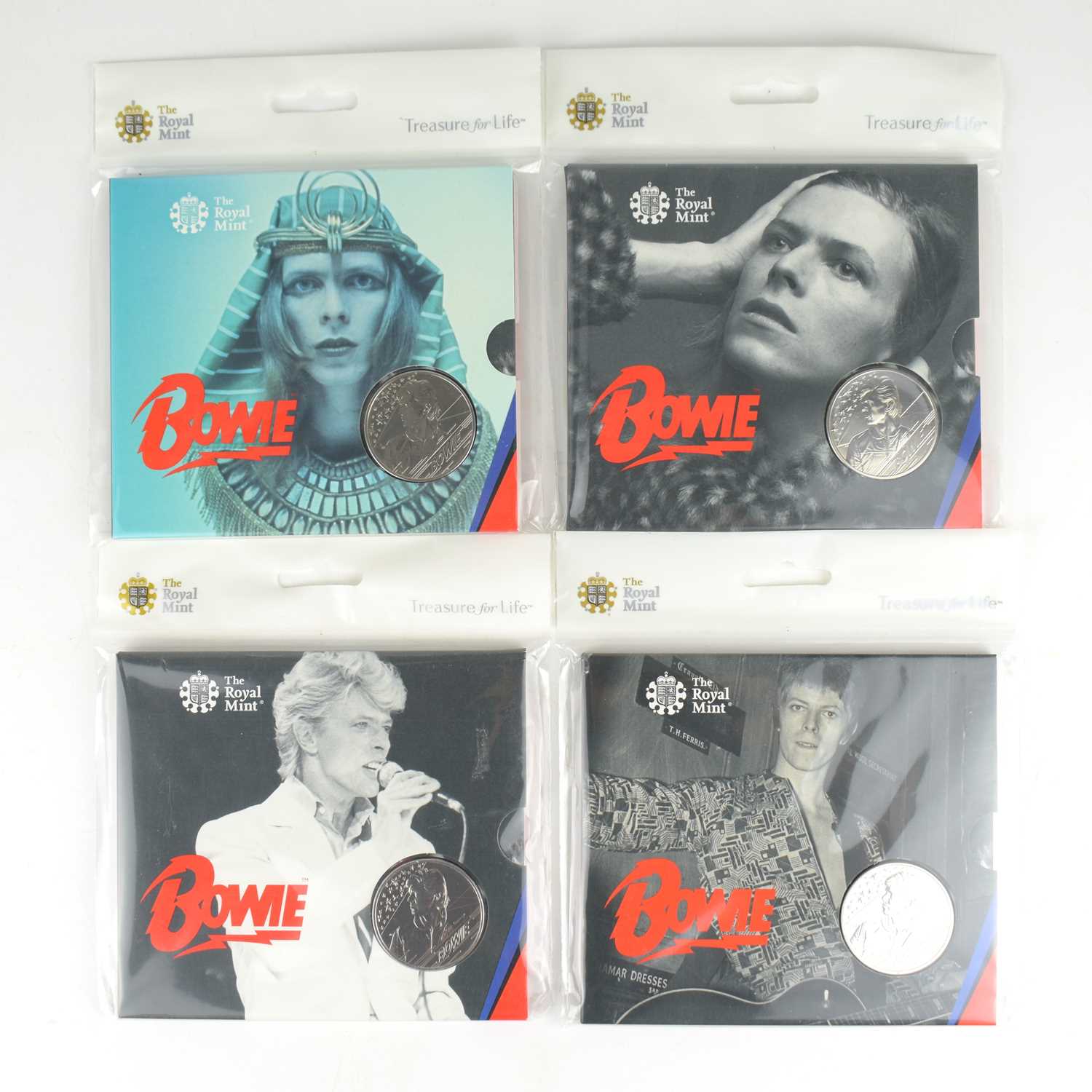 ROYAL MINT; four David Bowie commemorative £5 coin packs from the 'Treasures for Life' series, all