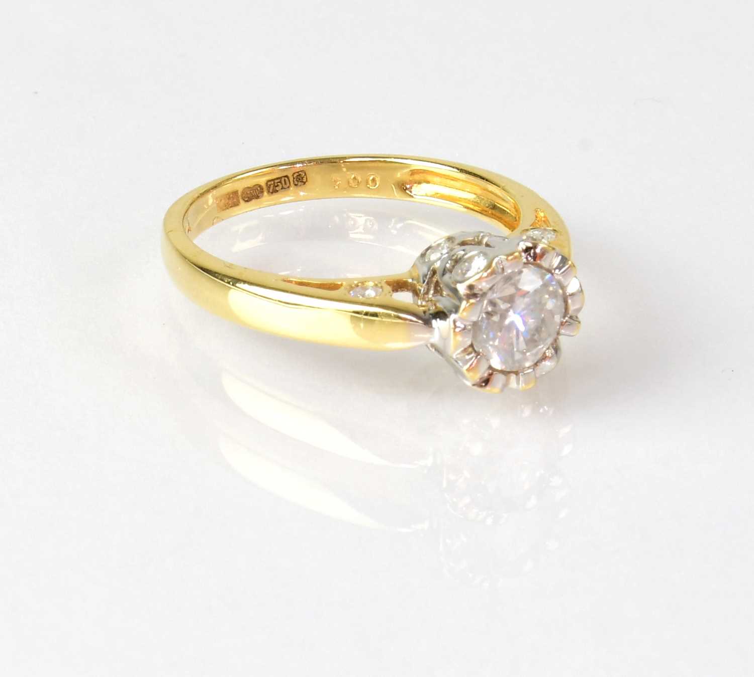 An 18ct yellow gold solitaire diamond ring, the stone in an unusual setting, set with smaller - Image 2 of 3
