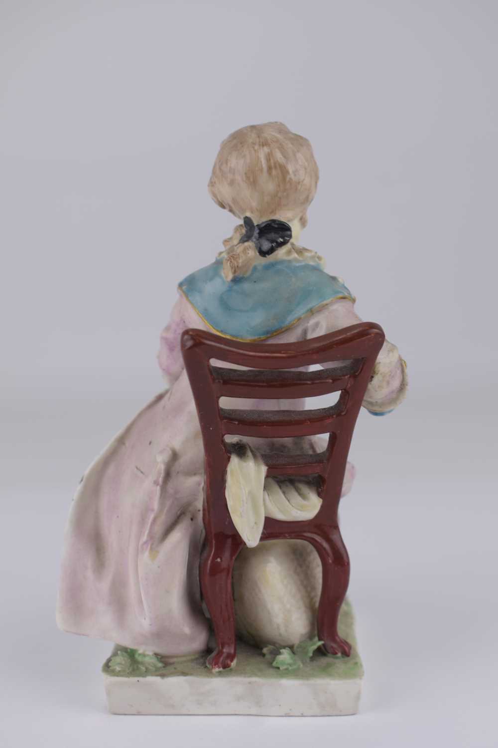DERBY; an 18th century porcelain figure depicting a boy with coat, sat on a chair, height 14.5cm, on - Image 3 of 5