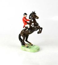 BESWICK; a huntsman on a rearing brown horse to naturalistic base, no.868, height 24cm. Condition