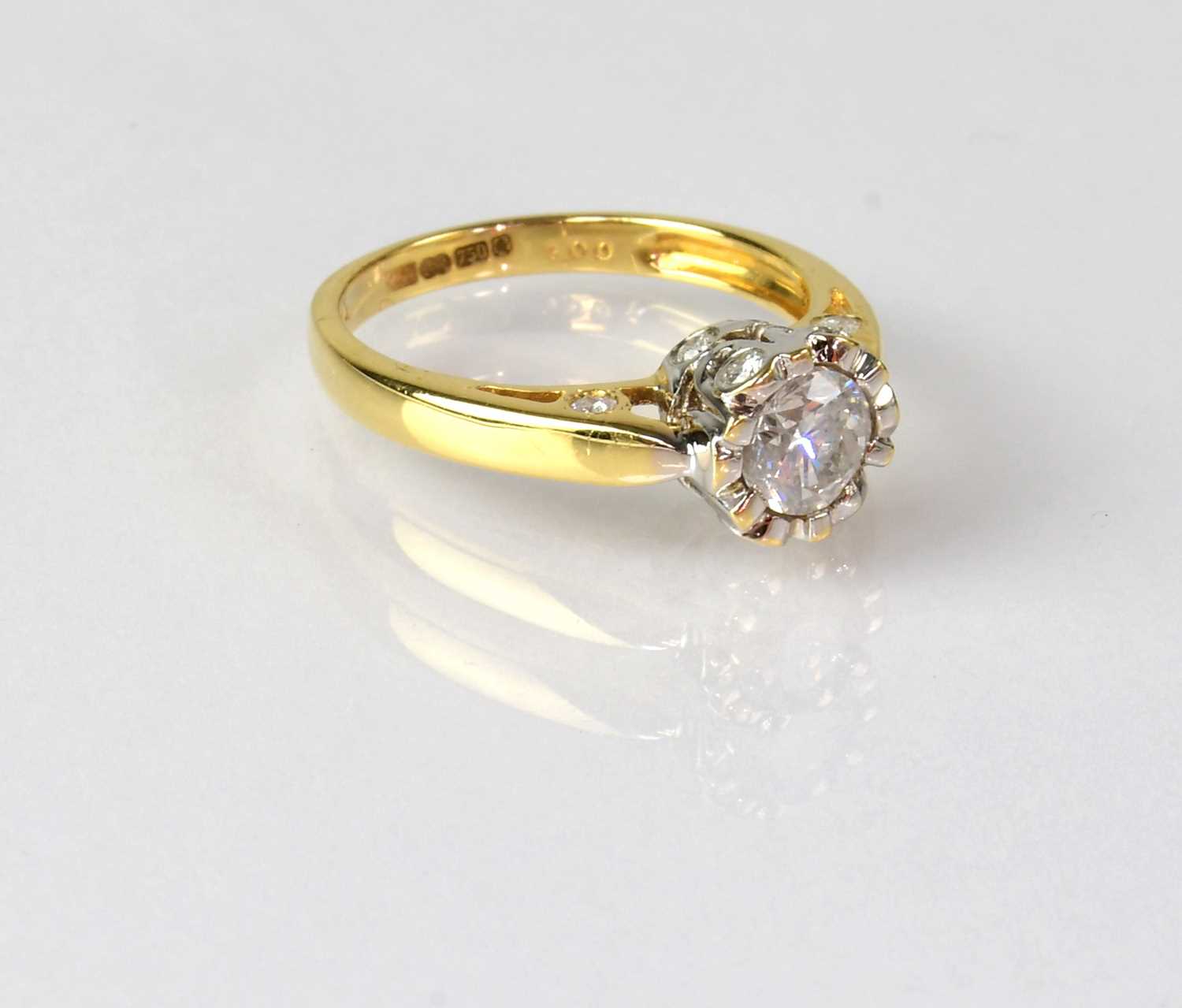 An 18ct yellow gold solitaire diamond ring, the stone in an unusual setting, set with smaller - Image 3 of 3