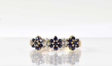 A 9ct yellow gold ring set with sapphire and diamond floral clusters, size P, approx. 1.9g.