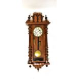A Vienna mahogany cased wall clock, the ivorine dial set with Roman numerals and secondary dial,