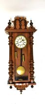 A Vienna mahogany cased wall clock, the ivorine dial set with Roman numerals and secondary dial,