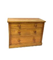 An early 20th century ash three-drawer chest with turned handles, 80 x 107 x 50cm.