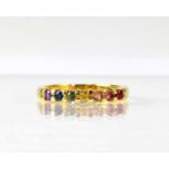 An 18ct yellow gold ring set with seven different coloured stones, size P, approx. 3.8g. Condition