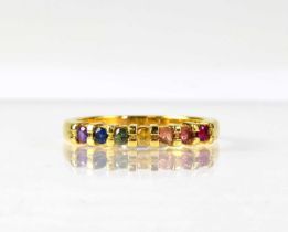 An 18ct yellow gold ring set with seven different coloured stones, size P, approx. 3.8g. Condition