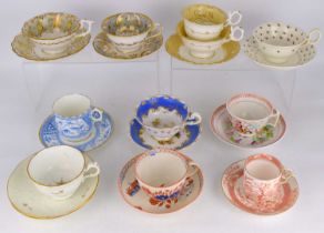 Ten 19th century porcelain and pottery teacups and saucers, some with landscape and floral