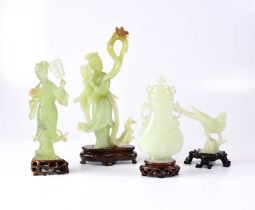 Four Chinese carvings, all with wooden stands, comprising two figures, a bird and an urn with lid (