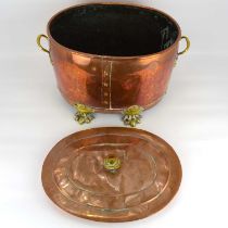 A 19th century copper and brass coal bucket of oval form, with turned brass handle to the lid, the