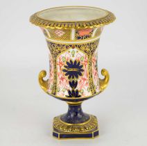 ROYAL CROWN DERBY; an 1128 Imari pattern twin-handled small urn-shaped vase, with factory stamp to