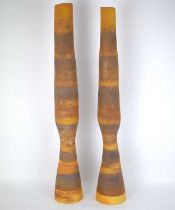 A pair of modern African-style cylindrical studio pottery vases with earth tones, unmarked, height