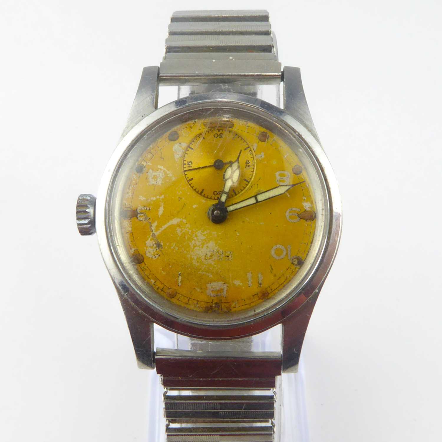 A gentlemen's vintage stainless steel crown wind wristwatch, the champagne-coloured dial set with