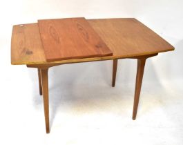 A mid-20th century teak G-Plan style extending dining table, height 74cm, length 169cm and a set