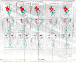 Five identical single leaded glass panes, each with a single red stained glass tulip and green