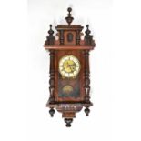 A Vienna wall clock in a mahogany case, the ivorine chapter dial set with Roman numerals, height