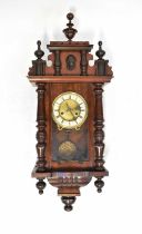 A Vienna wall clock in a mahogany case, the ivorine chapter dial set with Roman numerals, height