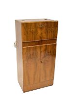 GEORGE SIRLIN & SONS LTD; a mid-20th century burr walnut cocktail cabinet with cantilever top