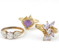 Three gold dress rings, comprising a 14ct gold white stone cluster ring, the central claw set