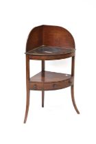 A late 19th /early 20th century mahogany two-tiered corner wash stand, with galleried back, above