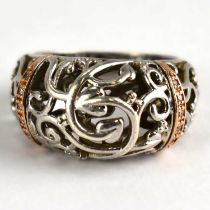 CLOGAU; a silver, rose gold and diamond ring from the 'Am Byth' collection, with openwork