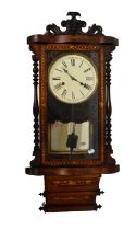 A Victorian rosewood and inlaid American drop-dial wall clock with shaped front, the white enamelled