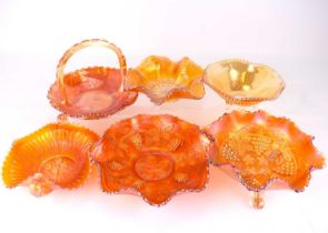 Six items of marigold-coloured carnival glass, comprising a basket, height 14cm, and five bowls with