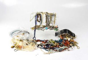 A collection of costume jewellery to include watches, beads, faux pearls, necklaces, rings, etc.
