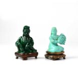 A Chinese carved turquoise kneeling figure of a female, holding a large bunch of grapes, on wooden