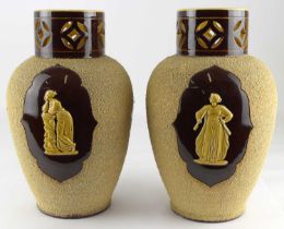 A pair of 19th century Victorian art pottery vases, the cylindrical neck with pierced Celtic star