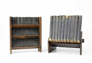 A three-tier open bookshelf containing forty miniature volumes of 'The Works of Shakespeare',