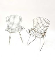 HARRY BERTOIA; four wire chairs, with cream leather seat pads (4). Condition Report: Only three seat