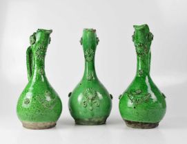 Three circa 1900 Channakale Western Turkish green glazed ceramic ewers, with applied floral