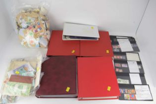 Four red albums of various first day covers, comprising two albums from the 1970s, one album from