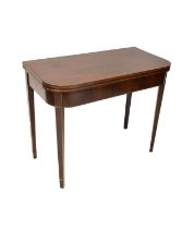 A 19th century mahogany tea table, the fold-over top with curved corners, raised on square tapered