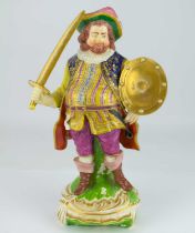 BLOOR DERBY; an early 19th century figure depicting Falstaff with sword and shield, resting