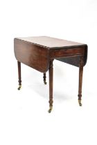 A 19th century mahogany Pembroke table with single frieze drawer, on turned and reeded tapering legs