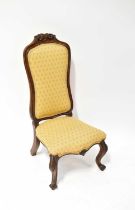 A Victorian walnut nursing chair with floral frieze top. Condition Report: 96 cm high x 40 cm wide x