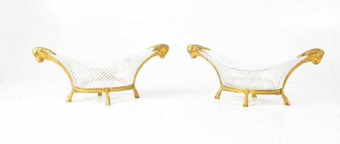 A pair of Empire-style cut glass bonbon dishes with gilt metal mounts in the form of rams’ heads,