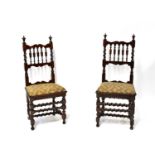 A pair of 19th century fruitwood side chairs in the 17th century manner, with turned spindle