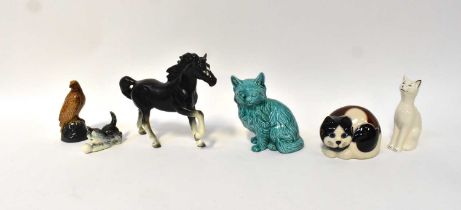 A small group of animal figures comprising a setter, four cats, a Beneagles Scotch whisky