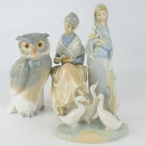 Four Spanish porcelain figures, to include a Lladró girl with lilies, height 23cm, a Nao owl, height