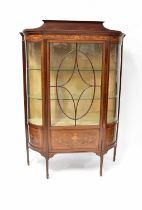 MAPLE & CO; an Edwardian-style inlaid mahogany display cabinet with astragal glazed door, curved