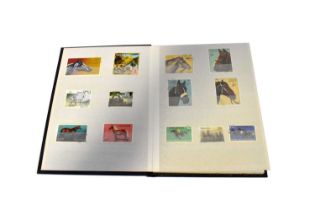 A small well-stocked stamp album containing various world stamps, all relating to horses.