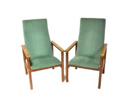 CROMWELL NORTON; a pair of retro teak-framed open arm elbow chairs upholstered in green velour,