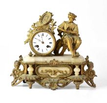 A gilded brass and alabaster figural mantel clock, the white enamelled dial set with Roman numerals,