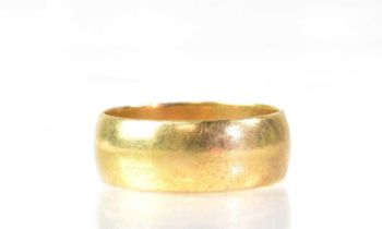 A 9ct yellow gold broad wedding band, size Y, approx. 8.4g.