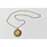 A Victoria 1882 gold sovereign, young head, in yellow metal mount and suspended on a 9ct necklace,