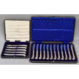 A cased set of twelve hallmarked silver handled pistol grip fruit knives, Sheffield 1936, and a