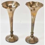 IS GREENBERG & CO; a pair of Edward VII hallmarked silver trumpet form vases, Birmingham 1905,